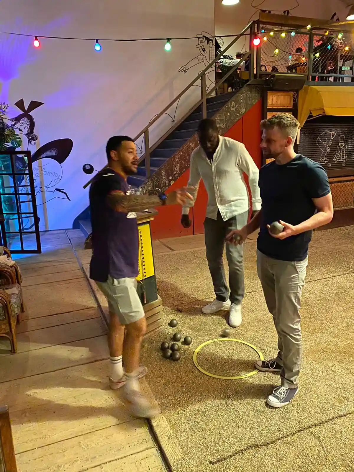 X&3K Team playing Petanque during night out